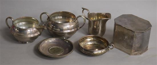 A George V silver sugar bowl and cream jug, a silver dish by A.E. Jones and three other items including a silver cream jug.